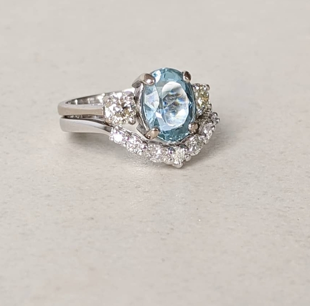 18-carat white gold diamond wedding ring with aquamarine engagement ring