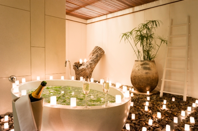 Thailand’s The Sarojin, bathroom with bathtub surrounded by candles