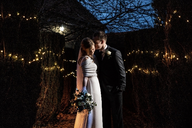 Couple surrounded by fairylights