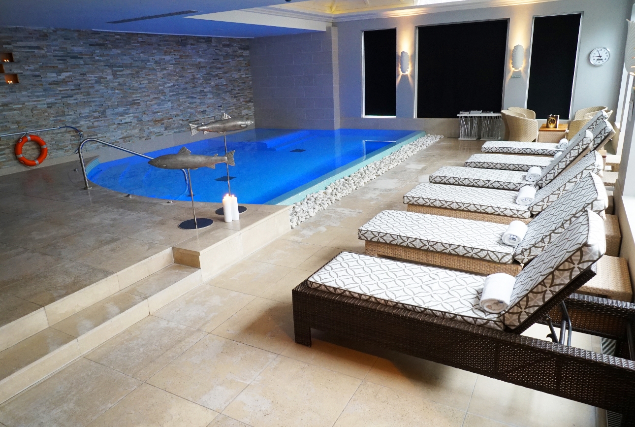 Inside Cotswolds Hotel & Spa in Chipping Norton with pool and loungers