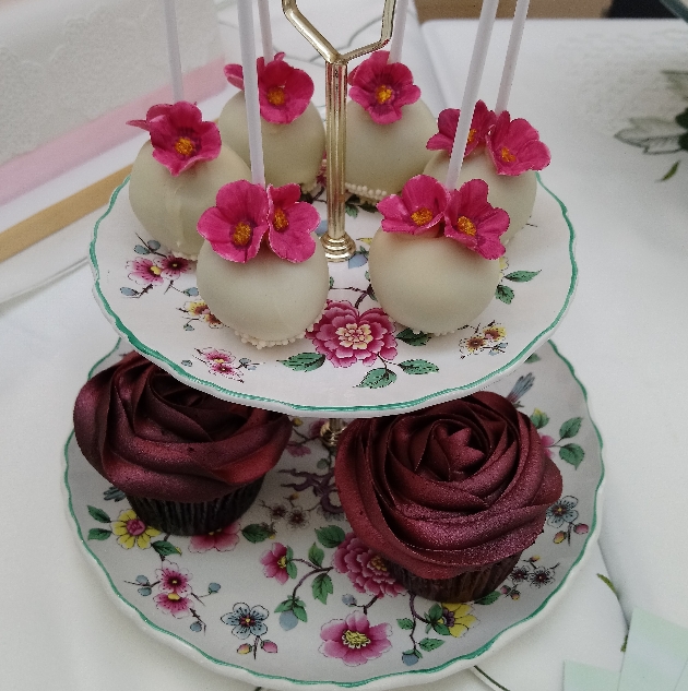 vintage cake stand with cupcakes and cakepops on it