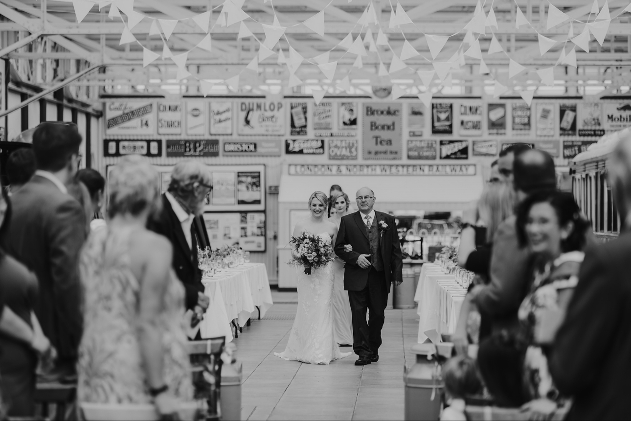 Father walking daughter down aisle