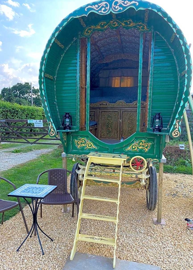 A gypsy caravan to book at Cotswolds Camping near Cogges Manor Farm