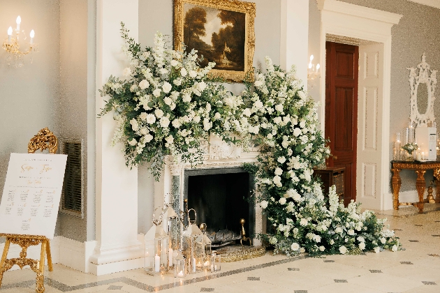 flowers around a large fireplace 