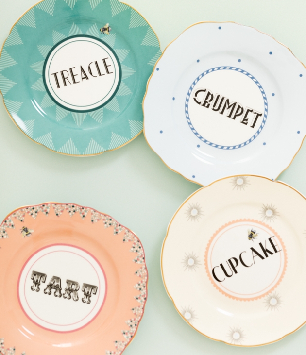 four vintage style plates with animals on