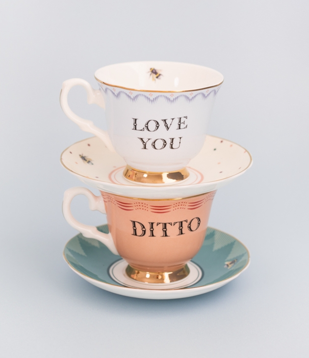two vintage style tea cups with 'love you' and 'ditto' on