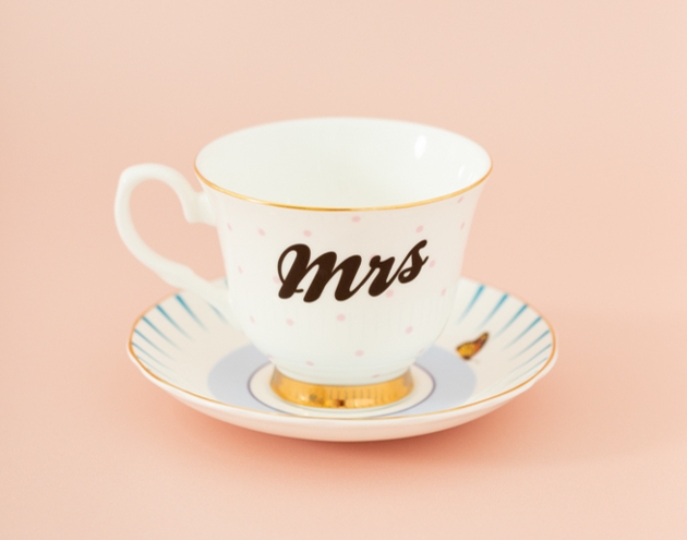 white tea cup and saucer with mrs on it