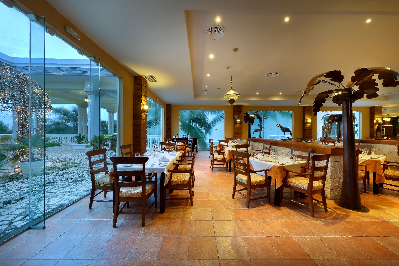 large restaurant with tables and chairs panoramic windows