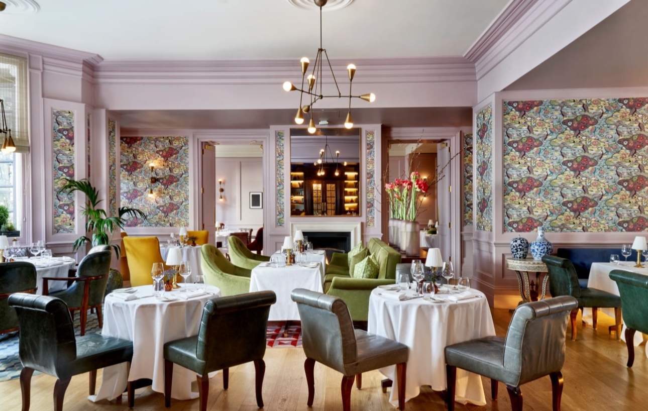 restaurant with pale pink paint and shabby chic patterned wall paper