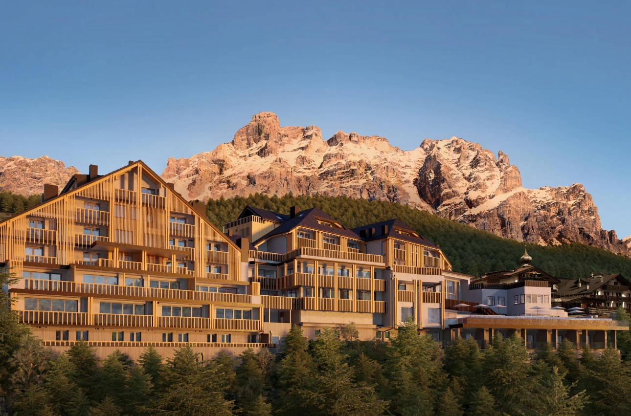 large building in front of some mountains