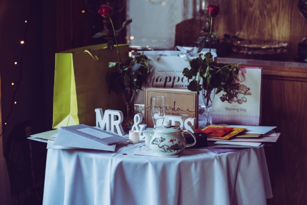 wedding gifts on a table mr and mrs signs