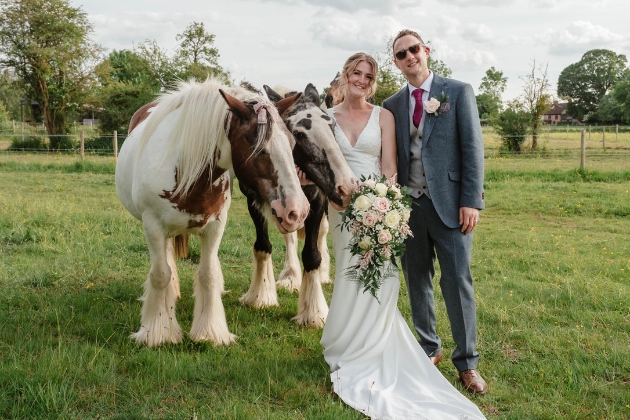 Bride Natalie with rescue horse Pumpkin on her wedding day in Gloucestershire