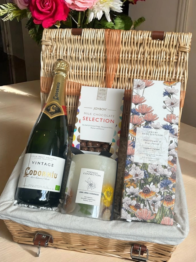 A open hamper with a selection of goodies