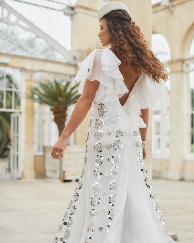 a tulle and silk chiffon dress with organza ruffles that's embellished with mirror artwork