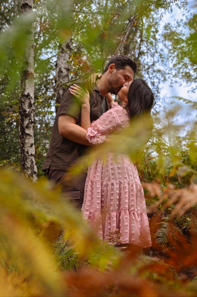couple embracing in the woods