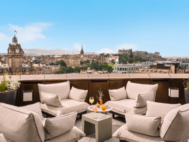 rooftop view with a table and chairs